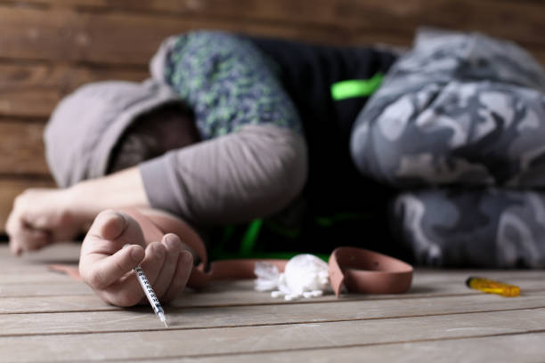 Social advertising on the topic of drug addiction Social advertising on the topic of drug addiction. The young drug addict lost seven, business, everything turned from him and he is not important for society morphine drug stock pictures, royalty-free photos & images