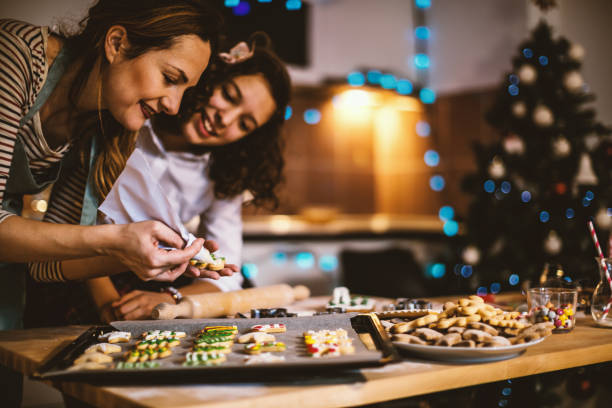 istock Mother and daughter making Gingerbread cookies for Christmas 855370990