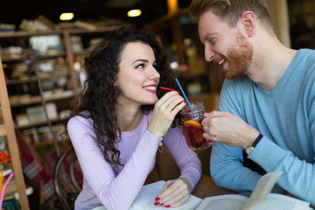 istock Young students spending time in coffee shop reading books 855372134