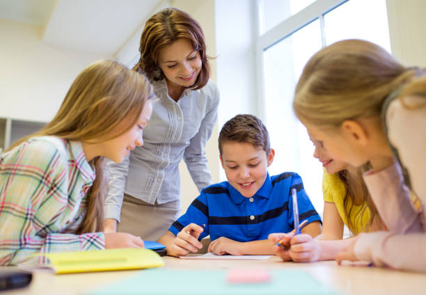 istock group of school kids writing test in classroom 855376290