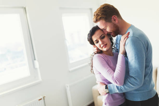 istock Young happy couple having romantic times at home 855382078