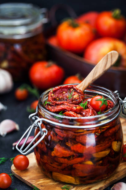 istock Sun dried tomatoes with garlic and olive oil 855382600