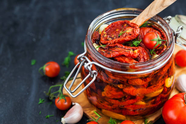 istock Sun dried tomatoes with garlic and olive oil 855382652