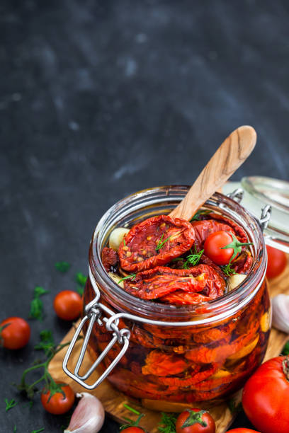 istock Sun dried tomatoes with garlic and olive oil 855382690