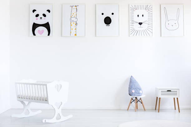 istock White baby's bedroom with posters 855383026