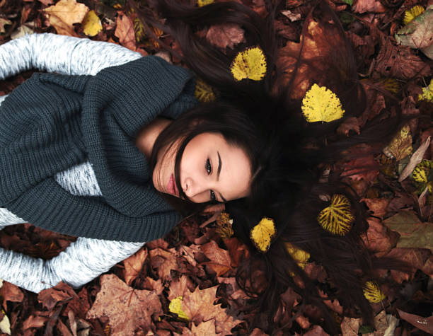 istock Woman laying on leaves 855383092