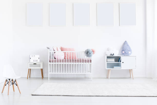 istock White posters in girl's bedroom 855383188