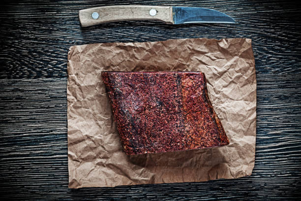 istock Meat casing paper knife on wooden board 855383314