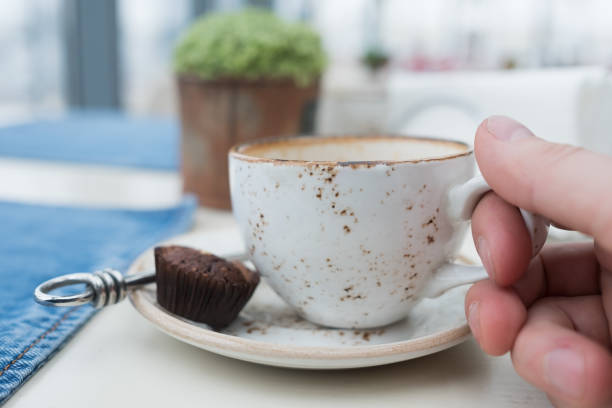 istock An empty cup of coffee on a wooden table. 855385566