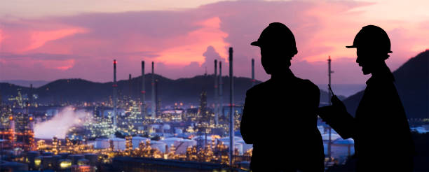 Silhouette engineers are standing orders The oil refining industry