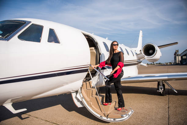 istock Woman entering airplane 855386428