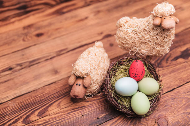 istock easter toy sheep near egg basket 855389350