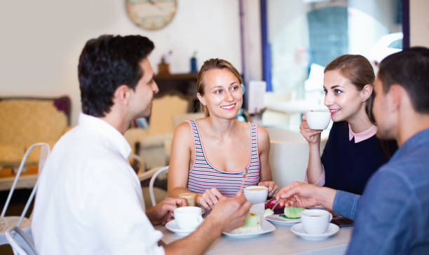 istock Friends meeting and drinking coffee with pastry at cafe 855394416