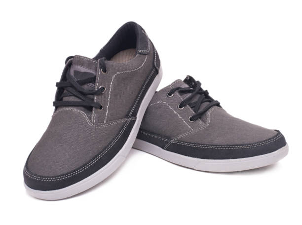 istock Pair of stylish grey sneakers isolated on white background with clipping path. 855397020