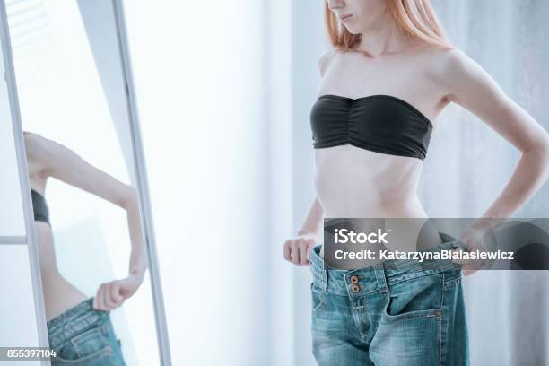 Woman Becoming Too Undersized Stock Photo - Download Image Now - Women, Underweight, Thin