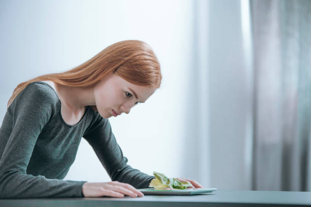istock Young girl following strict diet 855397140