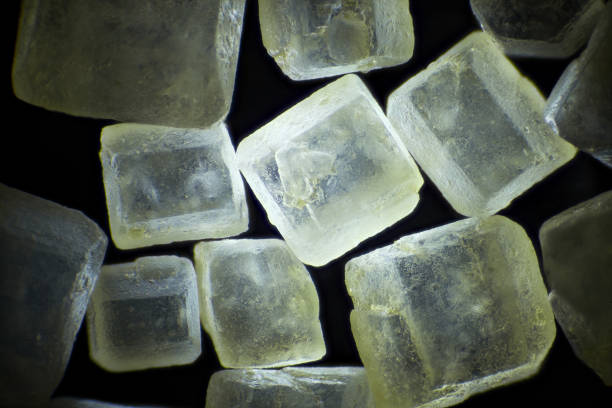istock Brown sugar on black background microscopic image, dark field technique, magnification x 40 855397830