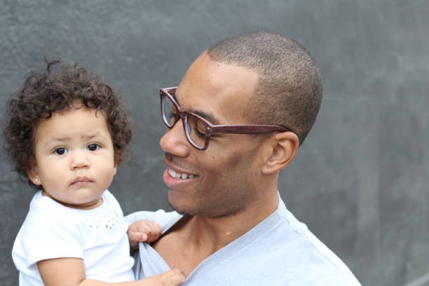 istock Father holding his cute little daughter 855402104