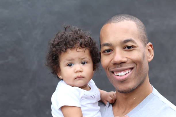 istock Happy black father and daughter embracing 855402108
