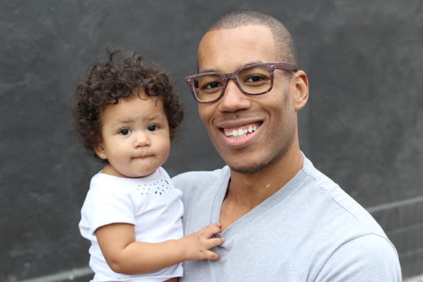 istock Father holding his cute little daughter 855402516