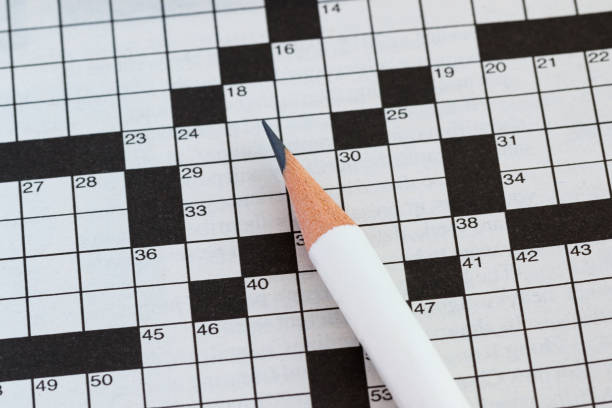 istock Crossword Puzzle and Pencil 855406672
