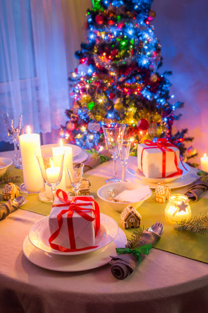 istock Beautiful Christmas table setting during the frosty winter evening 855410210
