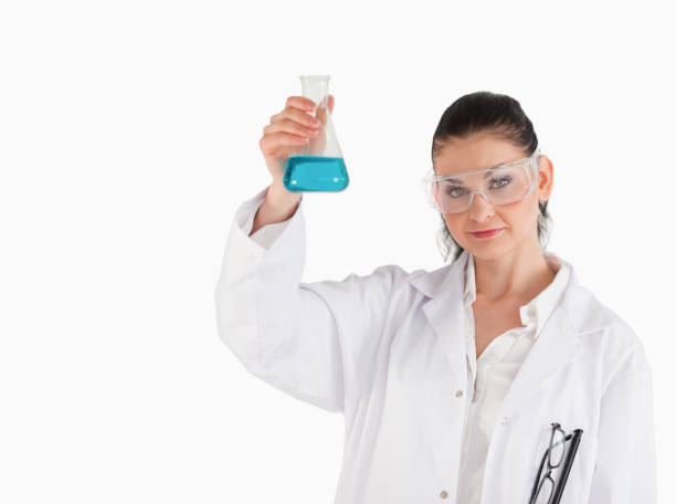 istock Darkhaired scientist holding a blue flask 855412960