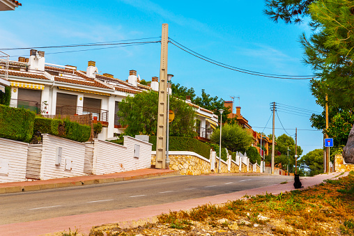 beautiful, picturesque street, narrow road, colorful facades of buildings, Spanish architecture, sunny day