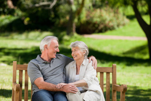 istock Senior couple sitting on a bench 855413922