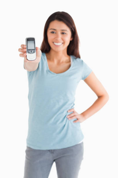 istock Attractive woman showing her mobile phone 855414182