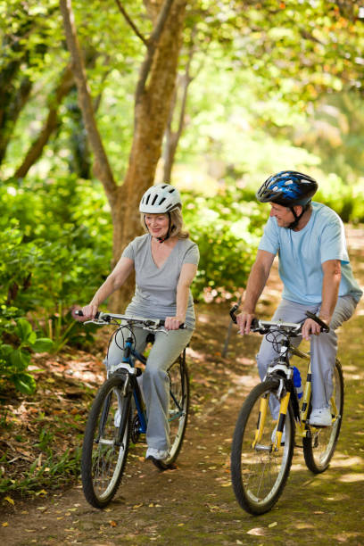 istock Elderly couple mountain biking outside 855416352