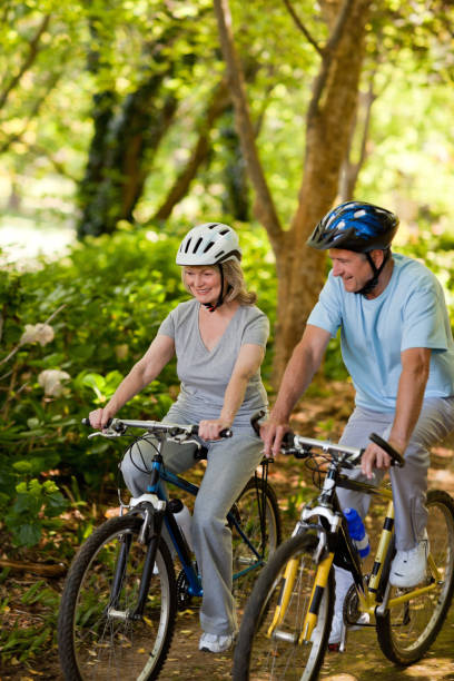 istock Elderly couple mountain biking outside 855416374