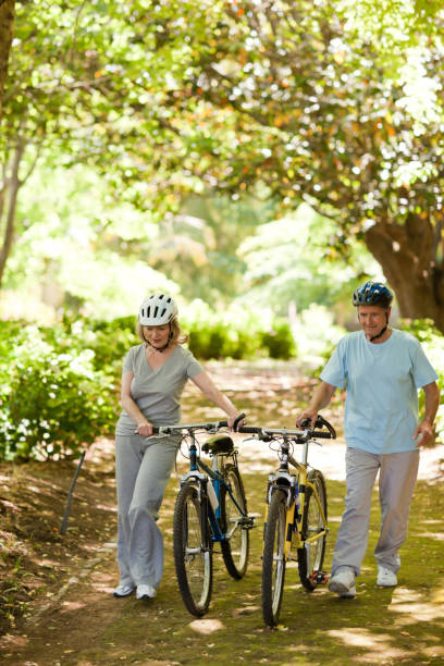 istock Couple with their bikes in the wood 855416494