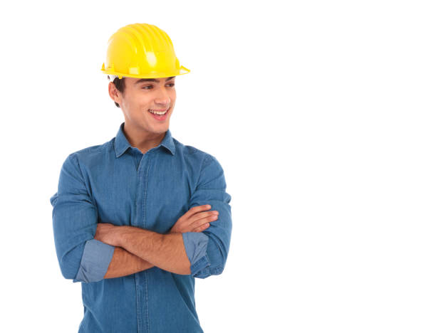 confident construction engineer smiles and looks away to side confident construction engineer smiles and looks away to side while holding his hands crossed on white background people laughing hard stock pictures, royalty-free photos & images