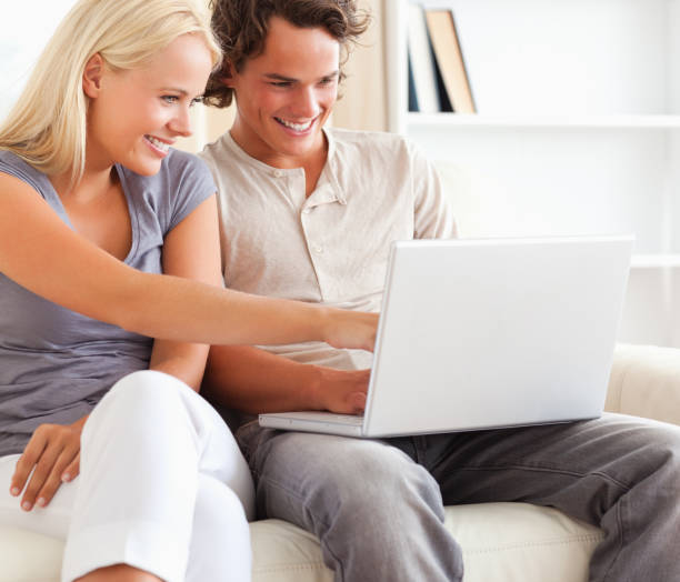 istock Close up of a couple using a laptop 855420426