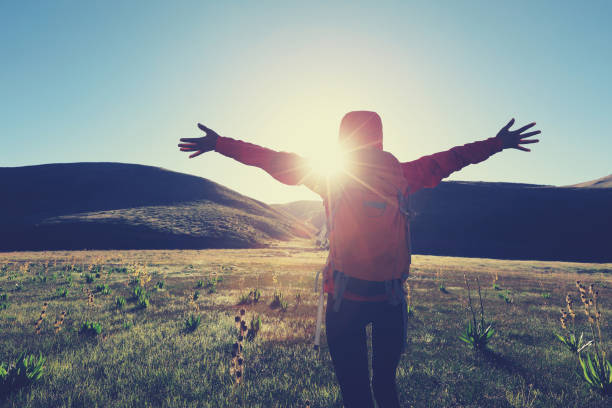 istock backpacking woman hiking in sunrise mountains 855421426