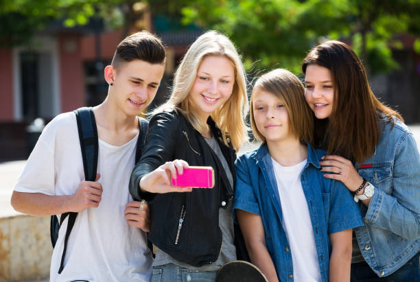 istock Teenagers taking mobile self picture 855423246