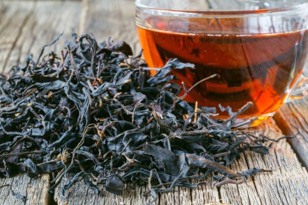 istock Dry and boiled cheenese tea, closeup view 855428638