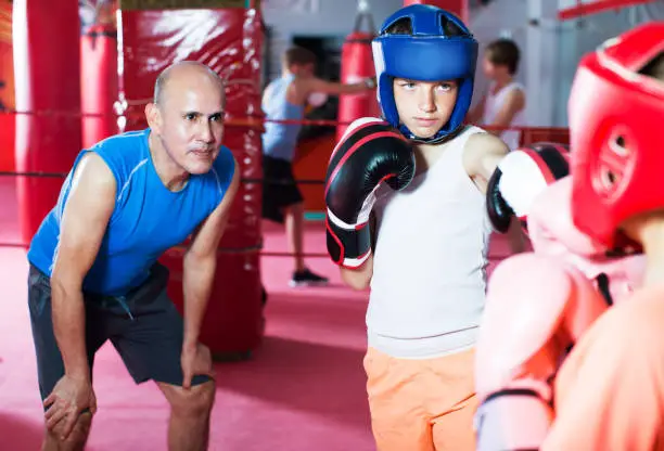 Photo of Children training on boxing ring