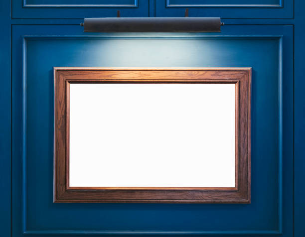 istock Mock up Blank Wooden Frame on blue wall with spot light 855430414