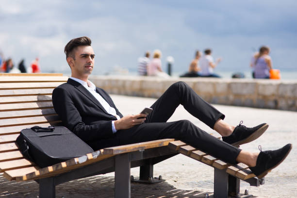 istock Pensive handsome manager relaxing on lounge chair 855432856