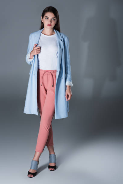 istock girl in blue trench 855433568