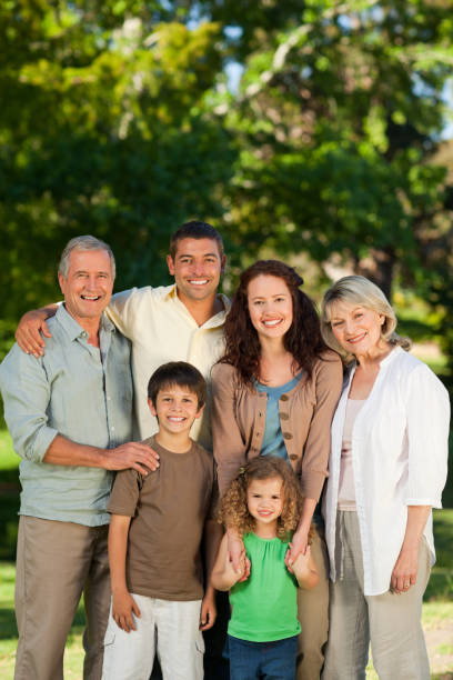 istock Family looking at the camera in the park 855433850