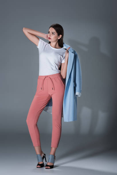istock girl in blue trench 855434202