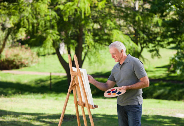 istock Senior man painting 855442998