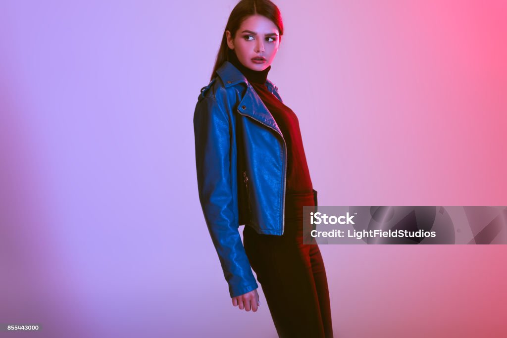 fashionable girl fashionable beautiful girl posing in leather jacket, on pink Leather Jacket Stock Photo