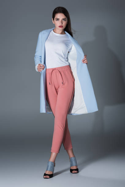 istock girl in blue trench 855443068