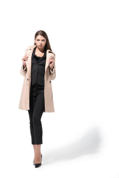 istock girl in trench coat 855443102
