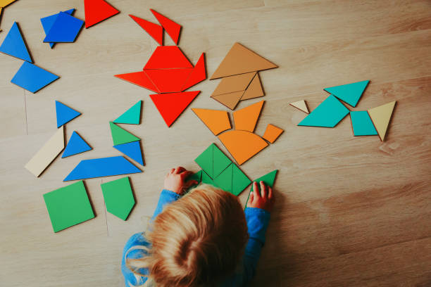 istock little girl playing with puzzle 855444728