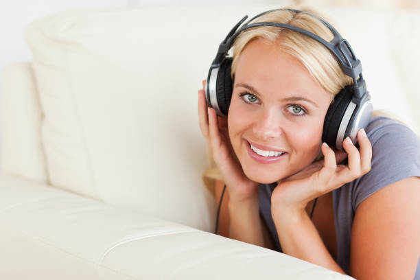 istock Blonde woman enjoying some music 855444804